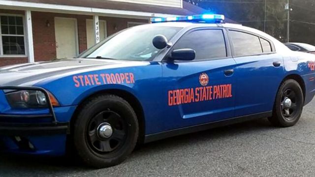 Officials say a Georgia State Patrol trooper died in a collision while performing their duties.